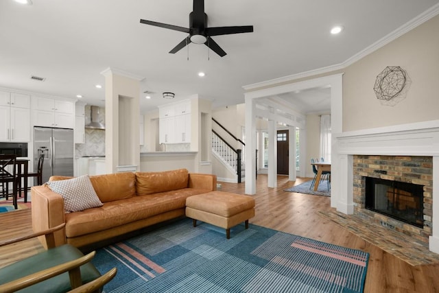 9417 Hopeland Dr, Austin, TX 78749 - living area with stairs, ornamental molding, light wood finished floors, ceiling fan, and recessed lighting
