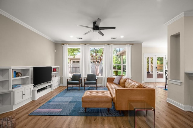 9417 Hopeland Dr, Austin, TX 78749 - living room featuring ornamental molding, a ceiling fan, plenty of natural light, wood finished floors, and recessed lighting