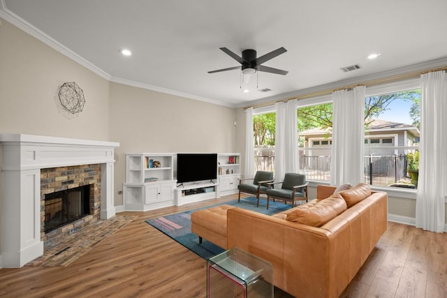9417 Hopeland Dr, Austin, TX 78749 - living room featuring plenty of natural light, light wood-style floors, ceiling fan, crown molding, and baseboards