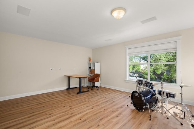 9417 Hopeland Dr, Austin, TX 78749 - miscellaneous room with light wood-style flooring, baseboards, and an office area