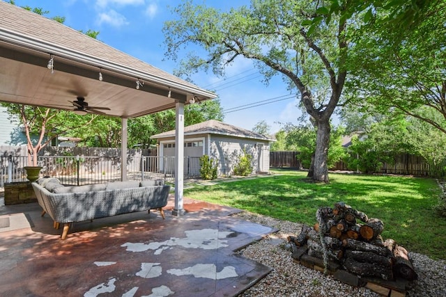 9417 Hopeland Dr, Austin, TX 78749 - view of yard with ceiling fan, an outbuilding, a patio, and an outdoor living space