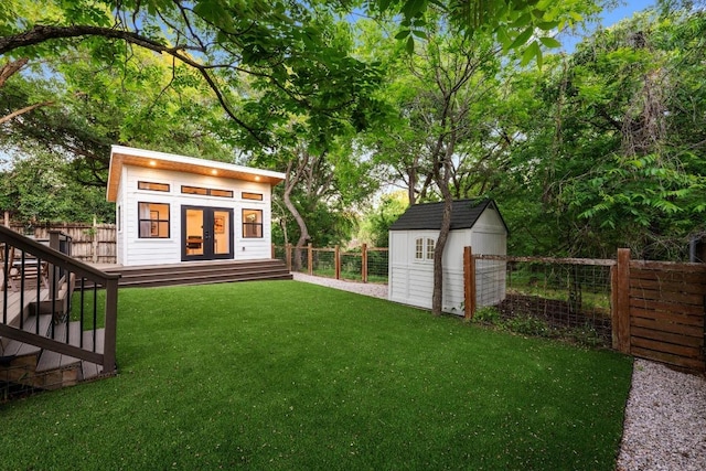 view of yard featuring a fenced backyard and an outbuilding