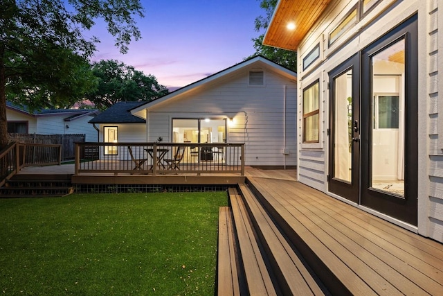 exterior space with a lawn and a deck