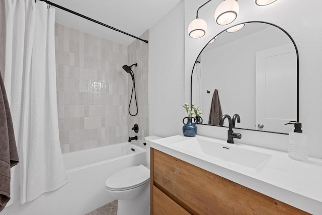 bathroom featuring vanity, shower / bath combo with shower curtain, and toilet