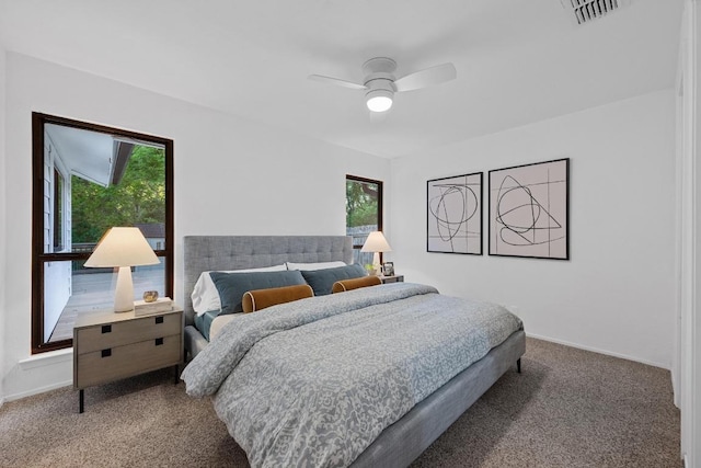 5229 Meadow Creek Dr, Austin, TX 78745 - carpeted bedroom featuring baseboards and ceiling fan