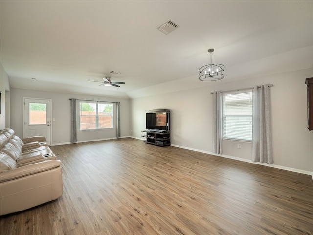 11904 Jamie Dr, Manor, TX 78653 - living area featuring wood finished floors, a chandelier, and ceiling fan