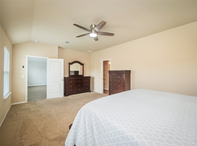 carpeted bedroom with baseboards, a ceiling fan, lofted ceiling, and visible vents
