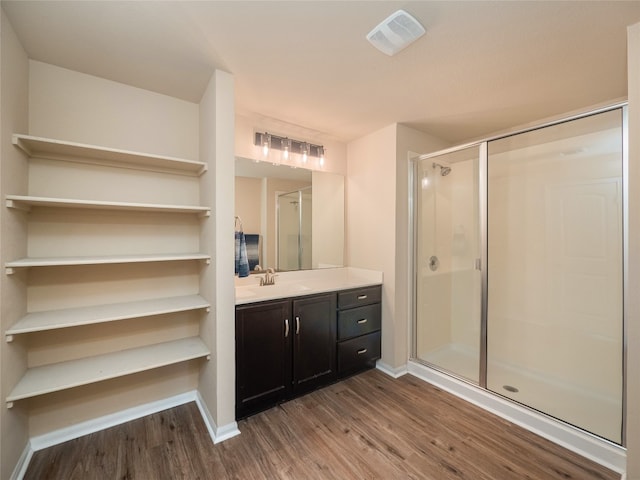 11904 Jamie Dr, Manor, TX 78653 - bathroom with wood finished floors, vanity, and a shower stall