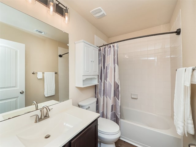 full bathroom with vanity, shower / bath combo, toilet, and visible vents