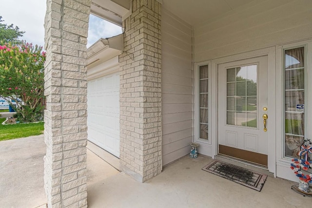 property entrance featuring a garage