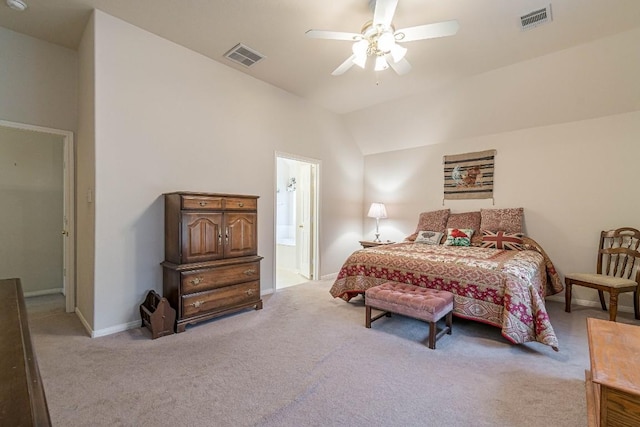 carpeted bedroom with visible vents, a ceiling fan, baseboards, and vaulted ceiling