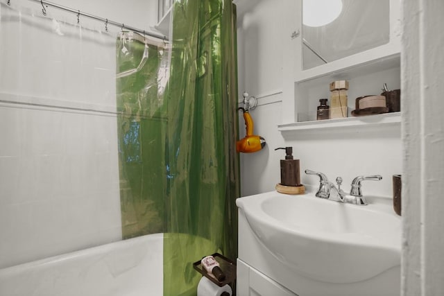 bathroom with a sink, a bath, and a shower with curtain