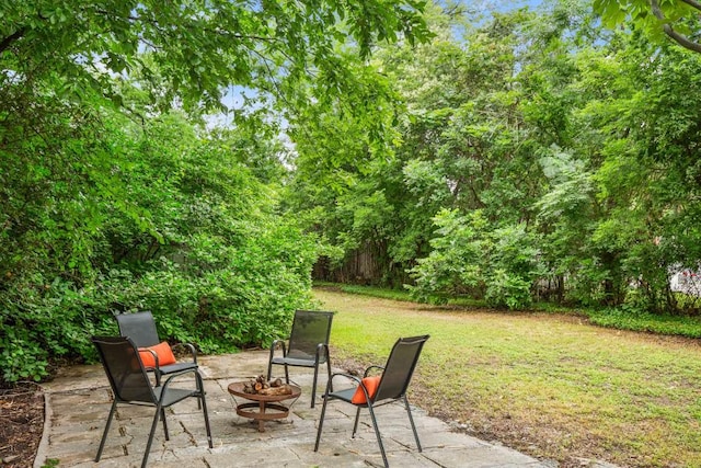 view of patio featuring an outdoor fire pit