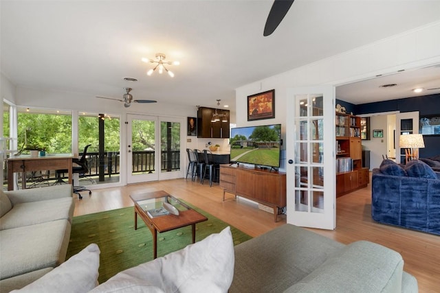 1712 Mccoy Pl, Georgetown, TX 78626 - living area featuring ceiling fan, french doors, and wood finished floors