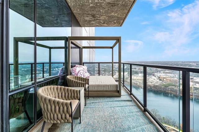 balcony featuring a water view
