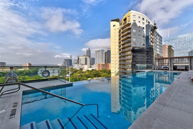 view of pool featuring a city view
