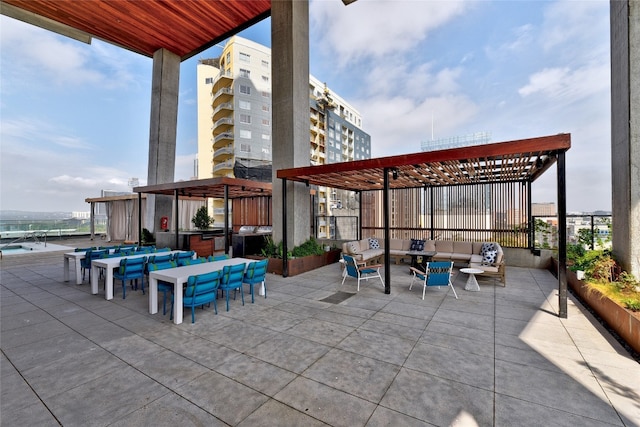 view of patio / terrace featuring a pergola and an outdoor hangout area