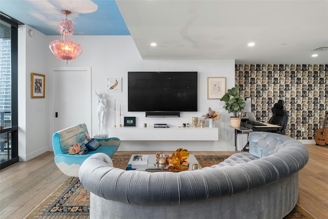 living room with visible vents, recessed lighting, baseboards, and wood finished floors