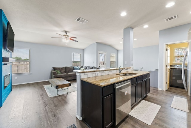 12717 Casting Dr, Manor, TX 78653 - kitchen featuring stainless steel dishwasher, plenty of natural light, wood finished floors, a ceiling fan, and recessed lighting