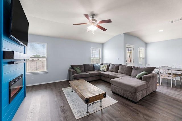 12717 Casting Dr, Manor, TX 78653 - living room featuring lofted ceiling, ceiling fan, and dark wood-style floors