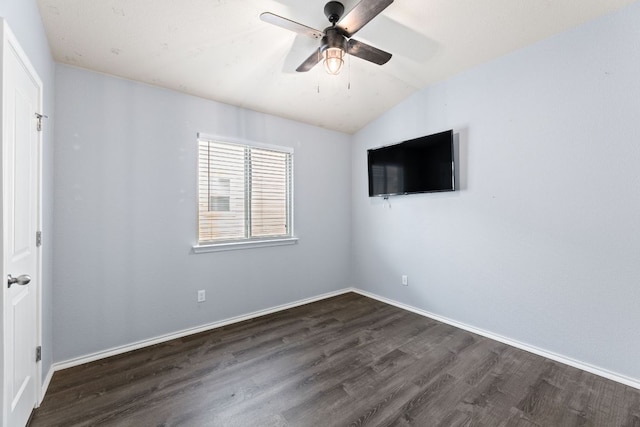 unfurnished bedroom with baseboards, ceiling fan, lofted ceiling, and dark wood-type flooring