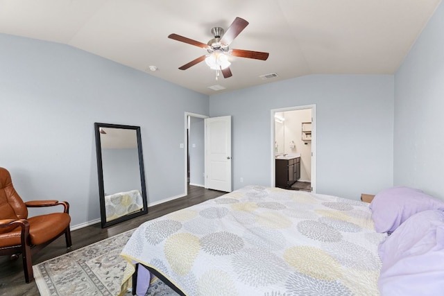12717 Casting Dr, Manor, TX 78653 - bedroom featuring lofted ceiling, dark wood finished floors, a ceiling fan, and ensuite bathroom