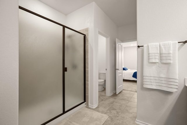 1625 Stinnett Dr, Leander, TX 78641 - full bath with connected bathroom, toilet, tile patterned floors, and a shower stall