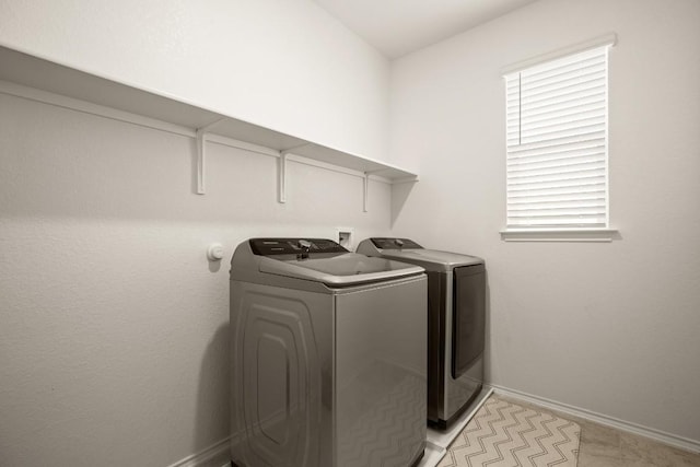 1625 Stinnett Dr, Leander, TX 78641 - washroom with separate washer and dryer, laundry area, and baseboards