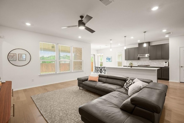 1625 Stinnett Dr, Leander, TX 78641 - living room with a wealth of natural light, ceiling fan, recessed lighting, and visible vents