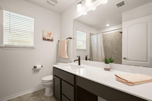 1625 Stinnett Dr, Leander, TX 78641 - bathroom featuring visible vents, baseboards, toilet, and vanity