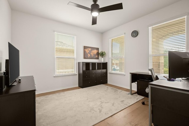 1625 Stinnett Dr, Leander, TX 78641 - office space with plenty of natural light, a ceiling fan, baseboards, and wood finished floors