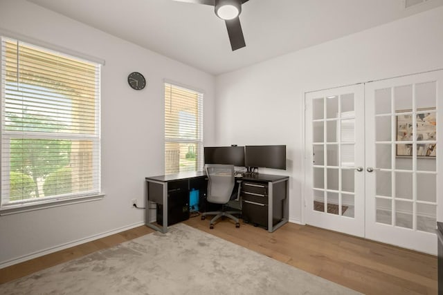 1625 Stinnett Dr, Leander, TX 78641 - office area featuring french doors, a ceiling fan, baseboards, and wood finished floors