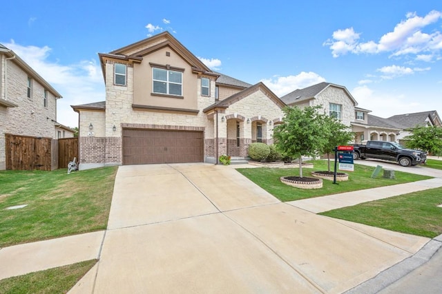 1625 Stinnett Dr, Leander, TX 78641 - view of front facade featuring a front yard, fence, concrete driveway, an attached garage, and stone siding