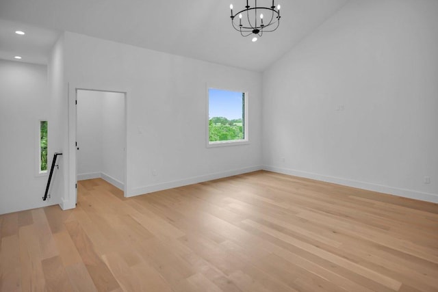 309 Alabaster, Horseshoe Bay, TX 78657 - unfurnished room featuring light wood-type flooring, high vaulted ceiling, baseboards, a chandelier, and recessed lighting