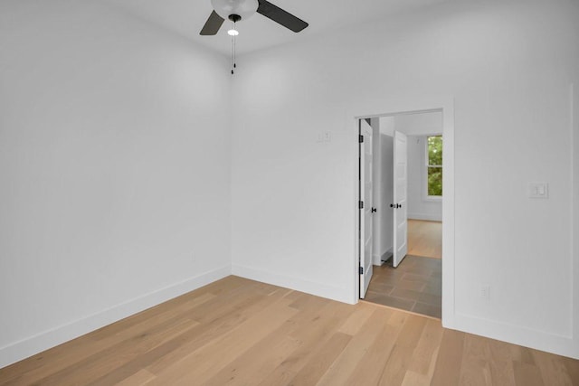 309 Alabaster, Horseshoe Bay, TX 78657 - spare room with baseboards, a ceiling fan, and light wood-style flooring
