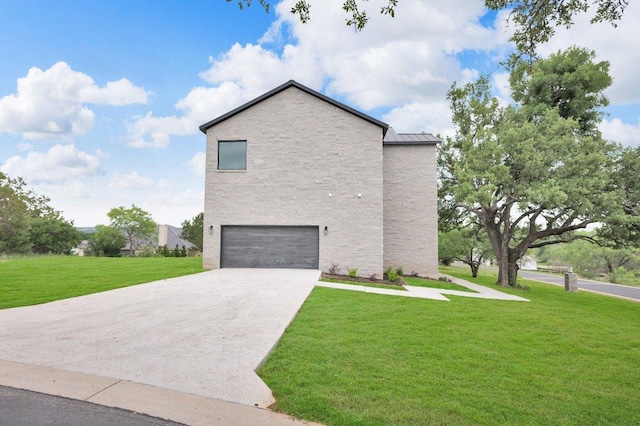 309 Alabaster, Horseshoe Bay, TX 78657 - view of property exterior with a lawn, a standing seam roof, metal roof, an attached garage, and driveway