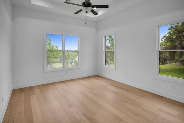 309 Alabaster, Horseshoe Bay, TX 78657 - empty room featuring a ceiling fan, baseboards, plenty of natural light, and light wood-type flooring