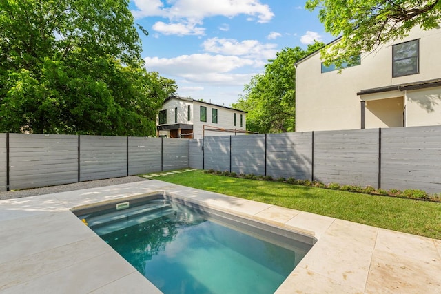 view of pool featuring a yard, a fenced in pool, and a fenced backyard