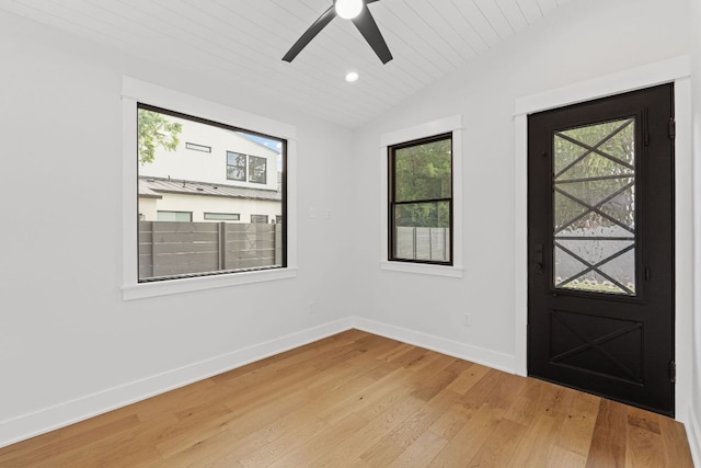 foyer featuring light wood-style floors, baseboards, ceiling fan, wooden ceiling, and vaulted ceiling