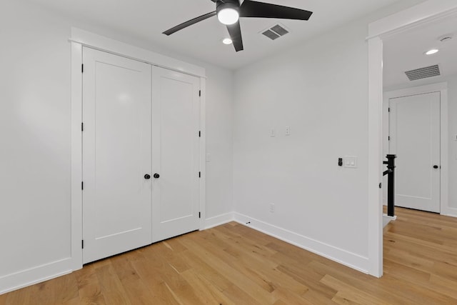 unfurnished bedroom with recessed lighting, baseboards, and light wood-style flooring