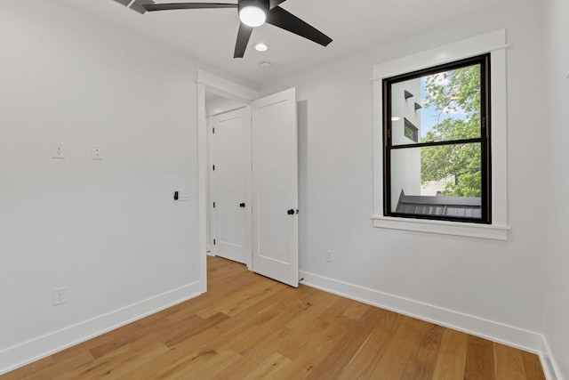 unfurnished bedroom with baseboards, a ceiling fan, light wood finished floors, and recessed lighting