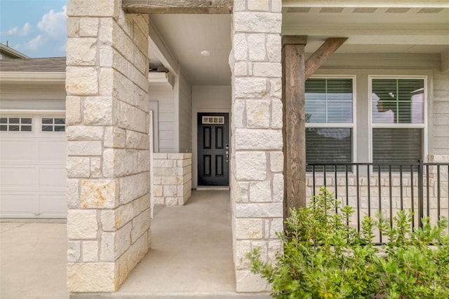 doorway to property with stone siding