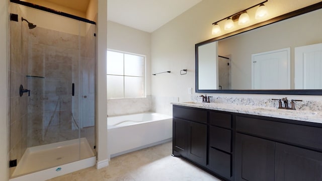 full bathroom featuring double vanity, a sink, a bath, and a shower stall