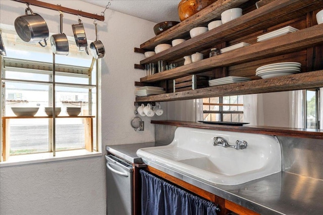 bar with a textured wall and a sink