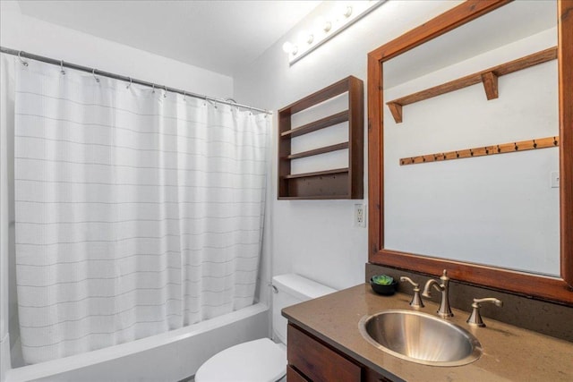 full bathroom with vanity, toilet, and shower / tub combo with curtain