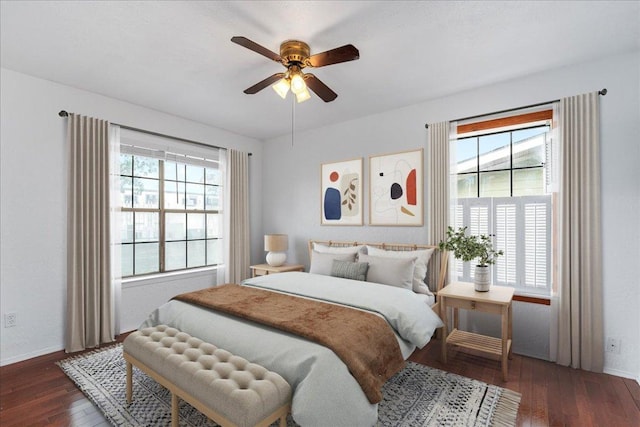 bedroom featuring baseboards, ceiling fan, and hardwood / wood-style floors