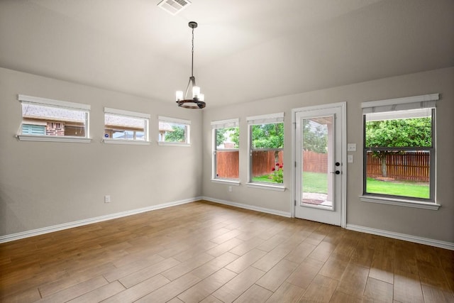 104 N Pasture Cv, Hutto, TX 78634 - unfurnished sunroom featuring a chandelier and plenty of natural light