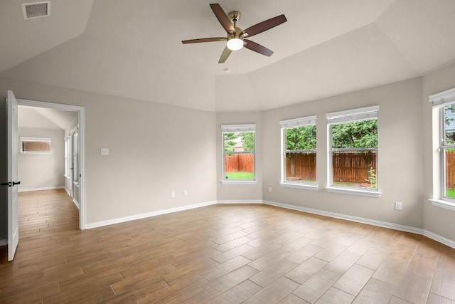 104 N Pasture Cv, Hutto, TX 78634 - spare room with ceiling fan, wood finished floors, vaulted ceiling, and healthy amount of natural light