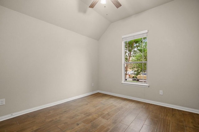 104 N Pasture Cv, Hutto, TX 78634 - spare room with a ceiling fan, dark wood-type flooring, vaulted ceiling, and baseboards