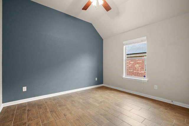 104 N Pasture Cv, Hutto, TX 78634 - spare room with a ceiling fan, wood finished floors, baseboards, and vaulted ceiling